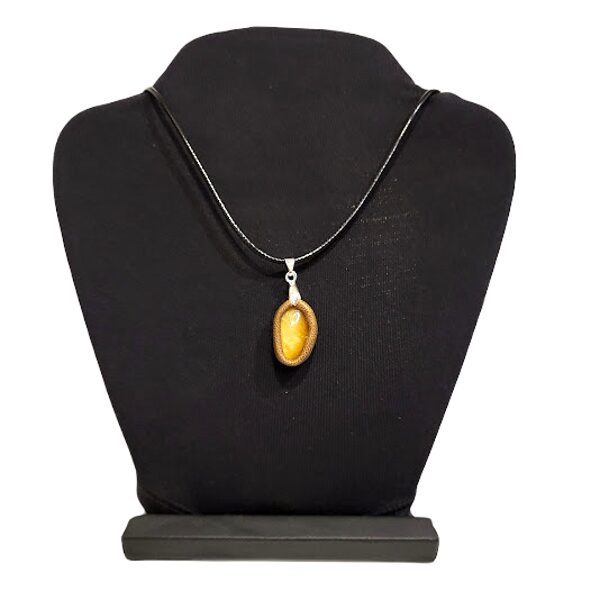 Amber pendant in a leather frame 1202203