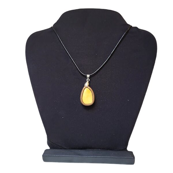 Amber pendant in a leather frame 1202204