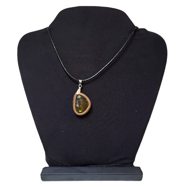 Amber pendant in a leather frame 1202216