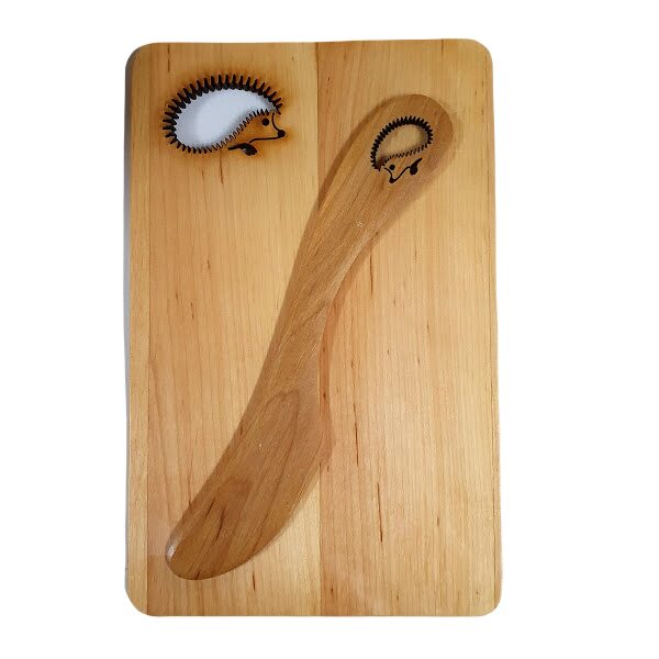 Wooden board with butter knife